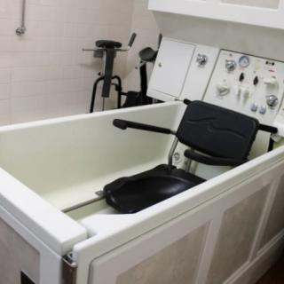 A hydrotherapy tub equipped for rehabilitation and therapy purposes in a healthcare setting.