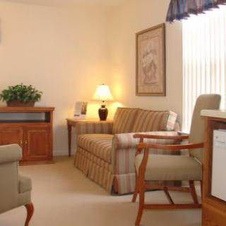 A cozy living room with comfortable furniture and warm lighting.