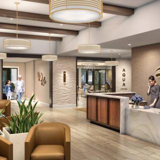 A modern lobby reception area with stylish furniture and decor.
