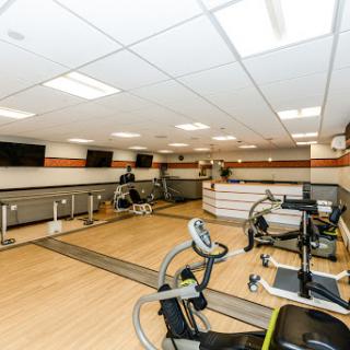 A well-equipped fitness center featuring exercise bikes and a clean, spacious layout.