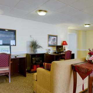 A neatly organized office space with furniture and decor.