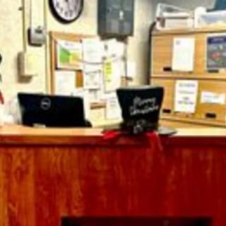 A festive hat decorates an office reception desk.