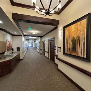 A well-designed hallway featuring elegant decor and artwork.