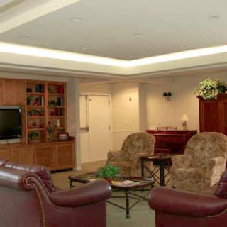 A cozy living room featuring comfortable seating and a television.