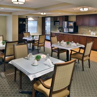 A well-arranged dining area with neatly set tables and comfortable chairs.