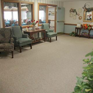 A calm and cozy living room with comfortable chairs and decor.
