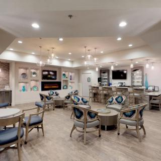 A modern, well-lit living room with comfortable seating and stylish decor.