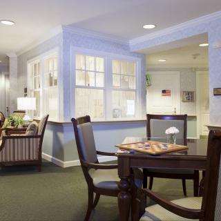 A cozy living and dining area with comfortable seating and warm lighting.