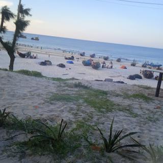 A serene beach view with soft sand and gentle waves.
