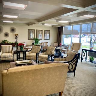 A spacious and well-lit waiting room featuring comfortable seating and tasteful decor.
