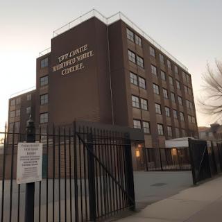 A community center building, showcasing urban architecture at dusk.