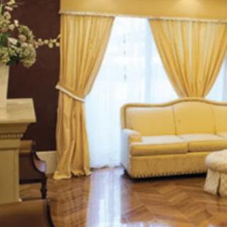 Elegant living room with luxurious sofa and curtains
