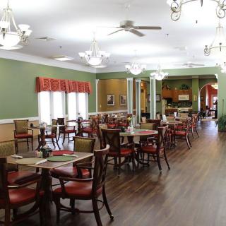 Spacious dining area with elegant furnishings and ambient lighting.