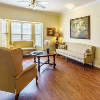 A cozy living room with stylish furniture and warm lighting.