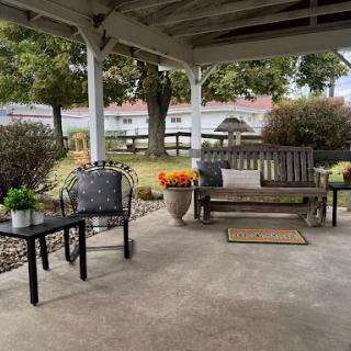 A cozy outdoor seating area perfect for enjoying a peaceful moment.