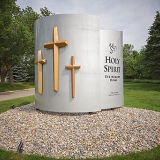Sign for Holy Spirit Lutheran Church featuring three crosses.