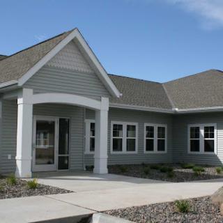 A modern single-family home with a welcoming entrance and well-maintained landscaping.
