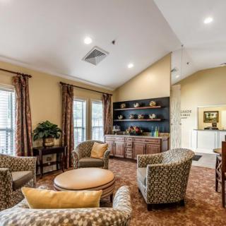 A cozy living room with comfortable seating and elegant decor.