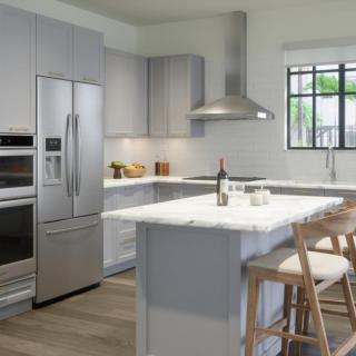 A modern kitchen with sleek appliances and a central island.