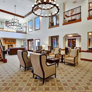 A bright and inviting lobby featuring elegant furnishings and stylish chandeliers.