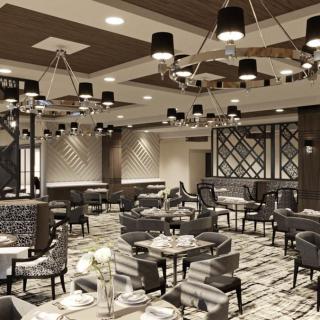 A modern and elegantly designed restaurant interior with stylish lighting and seating arrangements.