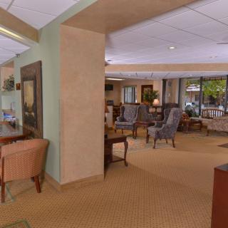 A spacious and elegantly furnished lobby with comfortable seating areas.