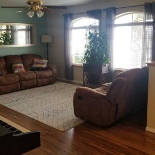 A cozy living room with comfortable seating and natural light.
