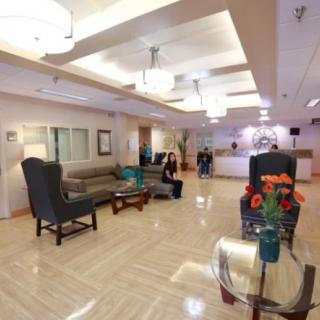 A spacious and modern lobby with comfortable seating and decorative elements.