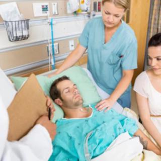 Medical team attending to a patient in the hospital.
