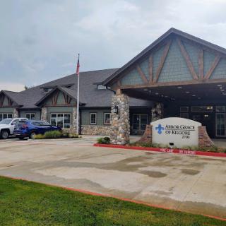 A modern medical facility with a welcoming entrance and landscaped surroundings.