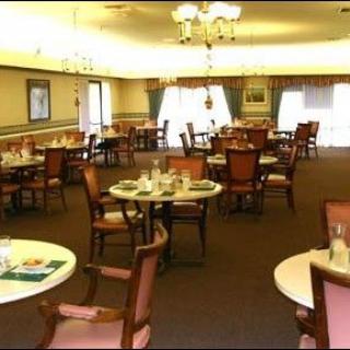 A cozy dining area with neatly arranged tables and chairs.
