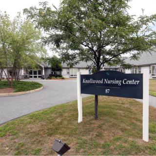 Entrance to the Rockwood Nursing Center with a sign in front of the building.