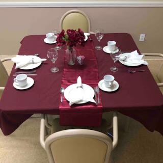 An elegantly arranged dining table set for a special occasion.