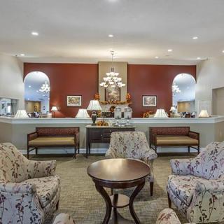 A well-furnished lobby with comfortable seating and elegant decor.