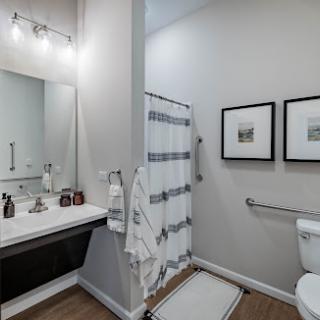 A contemporary bathroom featuring elegant fixtures and a minimalist aesthetic.