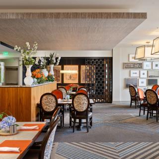 A beautifully decorated restaurant interior with neatly arranged tables and stylish decor.