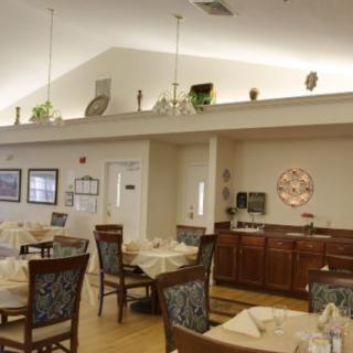 A well-decorated dining area with neatly arranged tables and chairs.