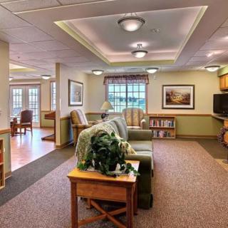 A cozy living room with comfortable seating and a television.
