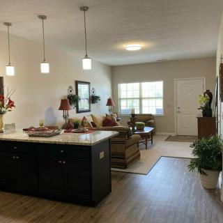 A modern open-concept living room with a kitchen island and contemporary decor.