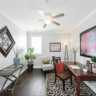 A modern home office with stylish decor and natural lighting.