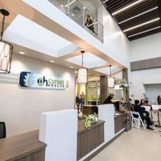 A welcoming reception area of a modern medical office, featuring bright lighting and stylish decor.