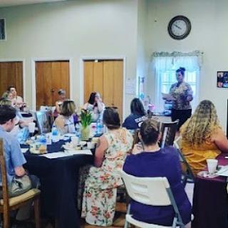 A lively gathering where attendees are engaged in a presentation.