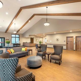 A cozy and well-designed lobby area featuring comfortable seating and elegant lighting.