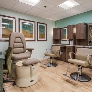 A calming spa or salon interior with comfortable chairs and soothing decor.