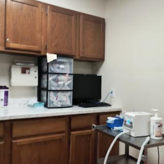 A glimpse into a medical office, featuring cabinets, storage, and essential equipment.