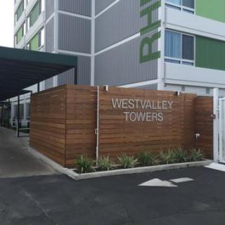 Entrance of Westway Towers, showcasing modern architectural design and a welcoming atmosphere.
