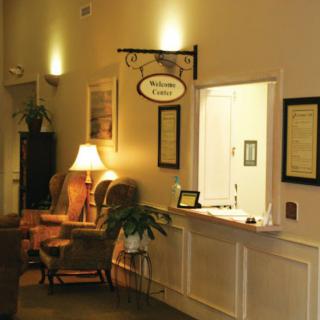 An inviting reception area with comfortable seating and warm lighting.