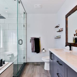 A modern bathroom with a glass shower and stylish vanity.