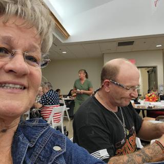 A cheerful moment at a social gathering, capturing smiles and camaraderie.