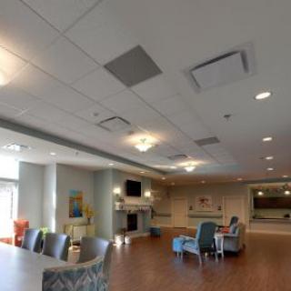 A spacious interior lounge area with comfortable seating and natural lighting.